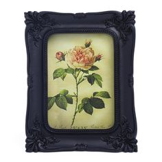 a painting of a pink rose with green leaves in a black frame on a white background