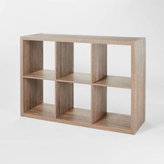 a wooden shelf with four sections on each side