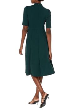 Donna Morgan Mock Neck Crepe Fit and Flare Dress | Available at Curated Brands in Los Angeles Green V-neck Fit And Flare Dress, Green Fit And Flare V-neck Dress, Chic Fitted Dark Green Midi Dress, Green A-line Dress With Fitted Bodice, Fitted V-neck Midi Dress In Dark Green, Green Fit And Flare Evening Dress, Green Fit And Flare Dress For Evening, Green Midi Dress With Fitted Bodice, Green Stretch Evening Dresses