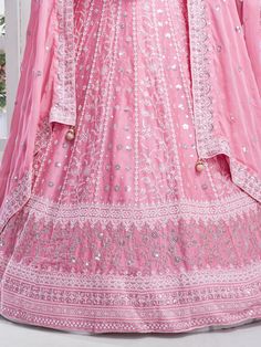 Elevate your style with the timeless elegance of this enchanting pink chiffon lehenga, adorned with intricate multi-embroidered work and shimmering sequins. The soft and flowing chiffon fabric drapes gracefully, exuding a delicate charm that is perfect for a variety of occasions, from weddings to receptions and beyond. Semi-stitched for convenience and comfort, the lehenga accommodates up to 42 inches, ensuring a flattering fit for different body types.
Paired with the lehenga is a chiffon choli Designer Pink Lehenga With Sheer Dupatta, Pink Organza Lehenga For Navratri, Pink Organza Saree Lehenga, Pink Organza Lehenga With Zari Work, Pink Lehenga With Sheer Dupatta For Navratri, Pink Organza Choli For Navratri, Pink Georgette Sets With Traditional Drape, Pink Organza Bollywood Lehenga, Pink Bollywood Organza Lehenga