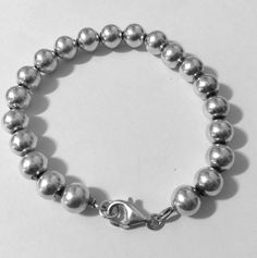 "This is a favorite style Sterling silver 8mm bead ball bracelet. Has lobster clasp closure for added security. Please note: Upto 1\" extender can be added at no additional cost. Must convo me, to let me know. Approx. 7\" Sterling silver bead ball bracelet Approx. 8mm Bead Ball size beads Approx. 14.3 grams REF: \"7\" Sterling Silver 8mm Bead Ball\" Bracelet" Classic Sterling Silver Bracelet With Beads, Classic Beaded Bracelets With Lobster Clasp As Gift, Sterling Silver Adjustable Bracelet With 8mm Beads, Silver Bracelets With 8mm Beads For Everyday, Classic Sterling Silver Bracelets With Spacer Beads, Adjustable Sterling Silver Bracelet With 8mm Beads, Classic Beaded Bracelets With Sterling Silver Clasp, Classic Hypoallergenic Round Sterling Silver Bracelet, Classic Sterling Silver Bracelet With Round Beads For Everyday