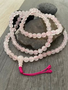 This rose quartz mala necklace has a light pink tone that will be easy to match your everyday outfits and keep you calm and grounded if you use it while meditating. Its a unique decor item also. A perfect gift for a yoga lover, or someone that loves stones. You can use it as a necklace or wrap it around the wrist and becomes a bracelet. The Mala necklace has a drop length of 43cm- 17 inch. A most have addition to your jewelry collection. ⚡️Join Akashi's VIP list for early bird discount access⚡️ Tibetan Mala, Rose Quartz Mala, Buddhist Bracelet, Wiccan Necklace, Yoga Lover Gift, Karma Necklace, 108 Mala Beads, Rose A, Rare Stone