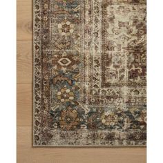 an area rug with various colors and patterns on it, including brown, blue, beige and