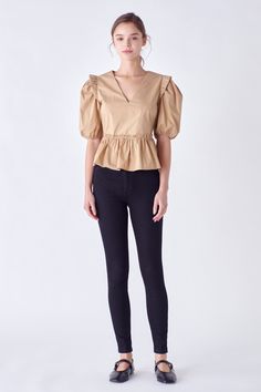 This V-neck Puff Sleeve Top is perfect for making a statement. Featuring ruffled shoulders and elasticated puffed short sleeves, you'll love showing off its peplum waist. With its unique styling and comfortable fit, this top is sure to become a favourite in your wardrobe. Make an impression and look your best with this must-have top. V-neck Puffy short sleeves with elastic armholes Ruffled shoulders Peplum hem Concealed side zipper Lined bodice Hand wash cold Do not bleach Do not tumble dry Iron low Shell: 100% Cotton Contrast: 100% Cotton Exclusive of Elastic JJ2073T Total length :22.50" Bust :36" S WHITE, BLACK: Height 5'10" / Bust 33" / Waist 24.5" / Hip 35" TAN: Height 5'9" / Bust 33.5" / Waist 23" / Hip 34.5" Chic V-neck Peplum Top With Ruffles, Fitted Puff Sleeve Top With Elastic Shoulders, Chic Puff Sleeve Tops With Elastic Shoulders, Stretch Puff Sleeve Blouse With Ruffles, Stretch Puff Sleeve Work Top, Stretch Puff Sleeve Top For Work, Stretch Short Sleeve Puff Top For Work, Elegant Puff Sleeve Top With Ruffles, V-neck, Chic Stretch V-neck Puff Sleeve Top