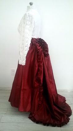 Gorgeous Red Satin Victorian Bustle Skirt With Train suitable for Steampunk, Edwardian, Historical Dress, & Weddings! Made of Satin material with ruffles at the bum with an attached train. Concealed side zipper with tie waist. GARMENT CARE Dry Clean or and Wash in Cold Water To add the corset belt; https://www.etsy.com/listing/921547733/corset-belt-elvin-fairy-pixie-goth?click_key=ba57ea81d19de802df60d10a5948a8827208abe3%3A921547733&click_sum=9f394b5f&ref=shop_home_active_1&crt=1&sts=1 Petticoat Red Fitted Victorian Dress For Party, Victorian Satin Dress With Ruffles For Costume, Red Fitted Ruffled Skirt, Fitted Ruffled Skirt For Costume Party, Fitted Red Ruffled Skirt, Red Fitted Ruffle Skirt, Steampunk Ruffled Skirt For Party, Vintage Ruffled Skirt For Costume Party, Vintage Ruffle Skirt For Costume Party