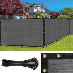 a large black privacy fence in front of a house