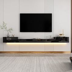 a living room with a large flat screen tv mounted on the side of it's wall