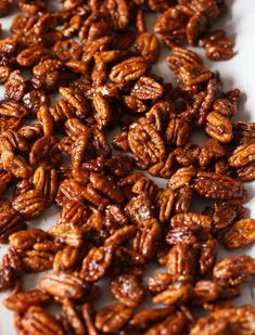 some pecans are sitting on a white surface