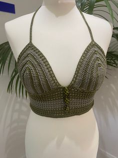 Handmade Two Tone Khaki Green Crochet Bralette Crop Top with adjustable tie back and bead embellishments This top is made with a beautiful high quality khaki yarn in two different shades, and features a fully adjustable halterneck tie, embellishments on the front and a fully adjustable tie up back.  Due to its customisable nature, this top would fit someone between the sizes of UK 6/8 to UK14, approximately A-C cup. Displayed on a UK size 8/10 mannequin. PLEASE NOTE - since this is a handmade item, its rather delicate so we recommend hand washing it only! Crochet Bralette, Green Crochet, Bralette Crop Top, Khaki Green, Tie Backs, Tie Back, Tube Top, Womens Clothing Tops, Bralette