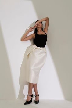 Xuyen Pegged Twisted Polished Cotton Midi Skirt | MEAN BLVD Chic Evening Draped Pencil Skirt, Chic Silk Pencil Skirt For Night Out, Chic Evening Wrap Skirt, Chic Silk Draped Midi Skirt, Chic Relaxed Evening Draped Skirt, Chic Evening Relaxed Draped Skirt, Elegant Draped Pencil Skirt For Night Out, Elegant Wrap Skirt For Night Out, Asymmetrical Silk Skirt For Cocktail