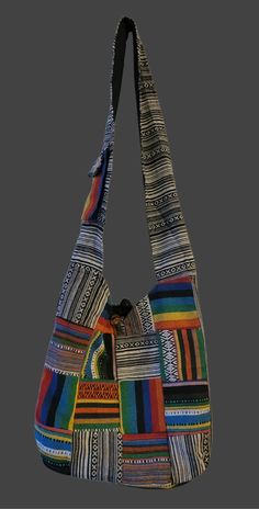 This vibrant cotton bag is expertly crafted with a colorful patchwork design and equipped with a crossbody strap for stylish and practical carrying. Made with cotton, this bag is perfect for daily use, offering long-lasting durability and comfortable portability. Each bag has different patches. Size: Width 13.5 inches x height 12 inches, broad strap. Entirely handmade in Kathmandu, Nepal. Multicolor Patchwork Hobo Bag For Everyday Use, Multicolor Patchwork Hobo Bag For Daily Use, Colorful Patchwork Shoulder Bag For Daily Use, Colorful Patchwork Shoulder Bag For Everyday Use, Casual Multicolor Patchwork Hobo Bag, Daily Use Multicolor Patchwork Hobo Bag, Multicolor Patchwork Crossbody Shoulder Bag, Bohemian Patchwork Cotton Shoulder Bag, Bohemian Cotton Patchwork Shoulder Bag