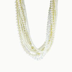 A glistening iridescence is the highlight of this one-of-a-kind, can't-miss multi-layered necklace. Satin ribbons, clear crystals, and white pearls in graduating sizes combine for a sartorial showstopper. Use the smooth ribbons to freshly fashion a short, medium, or long layered look - sophisticated and feminine - perfect for that special evening out! Fresh Water Cultured Pearls Pearl: Love - Beauty - Wealth Colors: Dove, Peach and Ivory Metal: Sterling Silver Length: 18" - 32" Adjustable Multi-strand Pearl Chain Necklace For Party, Multi-strand Pearl White Pearl Necklace For Party, White Multi-strand Pearl Necklace For Formal Occasions, White Beaded Necklace With Pearl Charm For Party, Pearl White Multi-strand Beaded Necklace, White Multi-strand Pearl Necklace For Party, Multi-strand White Pearl Necklace For Parties, White Pearl Embellished Beaded Necklace For Formal Occasions, White Multi-strand Pearl Necklace