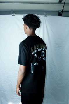 Travis Scott Graphic tee in Black, Regular Fit. Graphic Sports T-shirt With Text Print, Sporty T-shirt With Front Print For Streetwear, Sporty T-shirt With Back Print For Streetwear, Hip Hop Short Sleeve Sports T-shirt, Black Sports T-shirt With Back Print, Crew Neck Sports T-shirt With Graphic Print, Graphic Print Crew Neck Sports T-shirt, Urban Sports T-shirt With Text Print, Urban T-shirt With Text Print And Crew Neck