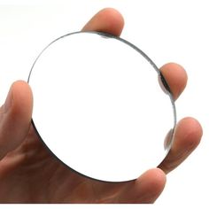 a person holding a circular object in their hand