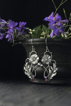 ITEM DESCRIPTION: Size H 65 x W 25 mm (2 1/2 x 2/3 inches) with closure. Weight - 4 g of each other. I made these botanical earrings of sterling silver, rhodolite and amethyst. This is very delicate and detailed work. These summer flowers look really elegant and amazing in silver. You can order these earrings with different gems. If you do not see your favorite version there, please write to me in convo and we will discuss your order. Jewelry will come to you in a gift box - ready for gifting. M Sterling Silver Flower Earrings Fine Jewelry, Silver Flower Drop Earrings In Fine Jewelry Style, Silver Drop Flower Earrings In Fine Jewelry Style, Handmade Silver Botanical Earrings, Silver Botanical Earrings As Gift, Handmade Silver Nature-inspired Earrings, Silver Botanical Earrings For Gift, Botanical Silver Earrings For Gift, Botanical Style Silver Earrings For Gift