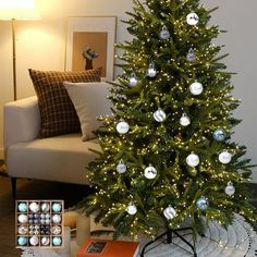 a living room with a christmas tree in the corner