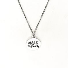 This silver necklace is a simple but beautiful gift for a loved one in your life. It is a stainless steel laser engraved charm on a stainless steel link chain. The charm has the following on it: Walk by Faith This necklace is available on a chain in your choice of 16, 18, 20, 22, 24, 26, 28 or 30 iInches. The pendant is also available for separate purchase if you have another necklace on which you would like to wear it. Each item comes individually boxed and ready to give as a gift. This jewelry Inspirational Personalized Stainless Steel Jewelry, Personalized Inspirational Stainless Steel Jewelry, Inspirational Nickel-free Silver Charm Necklaces, Inspirational Silver Nickel-free Charm Necklaces, Inspirational Nickel-free Stainless Steel Jewelry, Adjustable Stainless Steel Charm Necklaces, Personalized Sterling Silver Necklace For Everyday, Inspirational Silver Stainless Steel Jewelry, Personalized Silver Stainless Steel Charm Necklaces