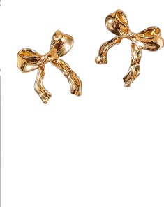 Chic Party Jewelry With Butterfly Knot, Chic Jewelry With Butterfly Knot For Parties, Chic Gold Earrings With Bow, Trendy Gold Earrings For Evening, Elegant Gold Earrings With Bow Tie Detail, Chic Gold Earrings With Decorative Bow, Formal Gold Earrings With Decorative Bow, Chic Evening Jewelry With Decorative Bow, Chic Party Jewelry With Ribbon