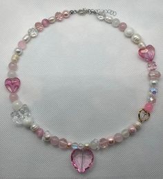 Handmade necklace Materials used: -glass crystal heart -glass beads -glass crystal beads -freshwater pearls Pink Beaded Heart Pendant Necklace, Pink Beaded Heart Pendant Jewelry, Sweet Pink Jewelry With Heart Beads, Pink Round Bead Necklaces For Mother's Day, Pink Beaded Necklaces For Mother's Day, Pink Round Beads Jewelry For Valentine's Day, Pink Round Beads Necklaces For Mother's Day, Pink Round Beads Necklace For Mother's Day, Pink Necklace With Round Beads For Mother's Day