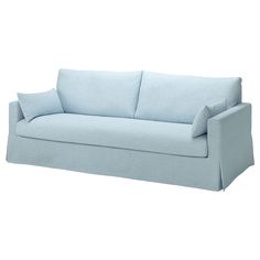 a light blue couch with two pillows on the back and one arm folded over it