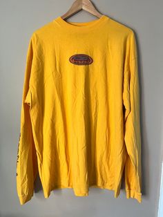 "100 % Cotton  Ocean Pacific Vintage  Size XLarge  USA Fabric  Measurements in inches:  Length:31\" Pit to Pit: 25\" Shoulder width: 25\"" Oversized Yellow Long Sleeve Top, Yellow Long Sleeve T-shirt With Screen Print, Y2k Oversized Long Sleeve Tops, Oversized Y2k Long Sleeve Top, Oversized Long Sleeve Y2k Top, Y2k Long Sleeve Screen Print T-shirt, Y2k Long Sleeve T-shirt With Screen Print, Long Sleeve Y2k T-shirt With Screen Print, Y2k Long Sleeve T-shirt For Streetwear