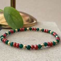 Christmas Seed Bead Bracelets This design bracelets are made of green agate, pearls and red agate stones.  When people think of the colors red and green, one thing comes to mind: Christmas.  Red has long been a powerful color associated with fire, spiritual awakening, and the blood of Jesus Christ, whose birthday is celebrated on December 25.  Green often symbolizes money, good luck, and health through the holidays and into the new year. ☆ Each of the pearls we use to create bracelets were forme Colorful Beaded Jewelry For Holiday Gifts, Holiday Jewelry Gift With Colorful Beads, Holiday Gift Jewelry With Colorful Beads, Festive Christmas Beads With Round Shape, Christmas Gift Beads, Festive Christmas Beads, Christmas Festive Round Beads, Festive Green Beaded Bracelets With Colorful Beads, Beaded Bracelets For Christmas Party