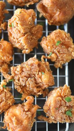 some fried food is sitting on a cooling rack