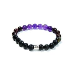 The Scorpio Zodiac Bracelet is created with a combination of Amethyst, Garnet, and Black Obsidian beads which resonate with the qualities associated with with the intense and transformative qualities associated with this zodiac sign. People with the Scorpio Zodiac sign were born between October 23 - November 21. Amethyst, with its calming purple hues, is paired with the fiery energy of Garnet. Black Obsidian adds a touch of grounding and protective energy, creating a bracelet that perfectly captures the passionate and mysterious nature of Scorpios.To add a personal touch, a silver-plated bead engraved with the Scorpio zodiac sign takes center stage in this bracelet. This symbolic element celebrates the unique characteristics of Scorpios – intense, intuitive, and fiercely loyal. Materials:- Scorpio Zodiac Sign, Protective Energy, The Scorpio, Zodiac Bracelet, Scorpio Zodiac, Unique Characteristics, October 23, Black Obsidian, Purple Hues