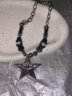 𝔇𝔢𝔱𝔞𝔦𝔩𝔰: Style: Punk, Goth, Alternative, Darkwear, Material: Alloy Metal The wearer of this punk necklace is taking a stand for meteorite fashion. The star pendant beads embrace trends while remaining timeless, crafted from durable metal with a cool, cratered texture inspired by the cosmos. Solid material, high-quality necklace Enjoy free shipping with a purchase of over 80$ Edgy Silver Beaded Jewelry, Emo Metal Necklace For Festivals, Edgy Silver Star-shaped Jewelry, Edgy Adjustable Star-shaped Jewelry, Adjustable Edgy Star Jewelry, Adjustable Edgy Star-shaped Jewelry, Silver Emo Style Necklace For Festivals, Trendy Star Charm Festival Jewelry, Silver Emo Necklace For Festival