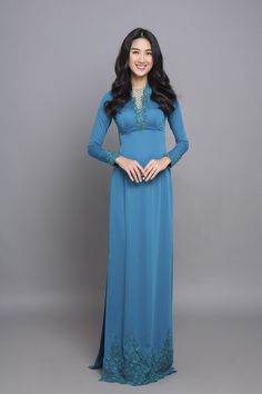 Round neck Fabric: Silk Long sleeves Type: modern ao dai Elegant Formal Ao Dai Maxi Length, Elegant Formal Maxi Length Ao Dai, Elegant Maxi Length Ao Dai For Formal Occasions, Elegant Long Sleeve Ao Dai For Wedding, Festive Fitted Cheongsam With Long Sleeves, Festive Formal Fitted Ao Dai, Fitted Long Sleeve Cheongsam For Wedding, Elegant Floor-length Ao Dai For Banquet, Wedding Long Sleeve Fitted Cheongsam