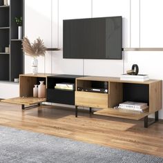 an entertainment center in a living room with bookshelves