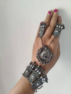 This beautiful oxidized Haath Phool is a part of Indian bridal jewelry.  This Indian ethnic Haath Phool comes with an attached adjustable Ring Haatphools are back in fashion after a very long time and have returned with a bang. This piece of oxidised black polish haathphool consists of a bracelet & a rink which is joined by chains. This gives off a very elegant & royal look if you pair it up with any outfit. We generally see brides wearing haatphool & this piece of Indian jewelry is very occasio Handmade Metal Bohemian Body Jewelry, Handmade Bohemian Metal Body Jewelry, Bohemian Metal Body Jewelry For Festivals, Adjustable Metal Body Jewelry For Wedding, Unique Metal Body Jewelry For Festivals, Unique Silver Body Jewelry For Festivals, Handmade Silver Body Jewelry, Elegant Toe Ring Jewelry For Festivals, Elegant Toe Ring For Festivals