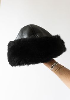 Leather and Shearling Cap in Black from Cawley. Cozy hat in black sheepskin with seaming details. Super warm and perfect for cold days. Need a second opinion? If you have special requests or just need advice, please reach out to hello@shop-vestige.com. 100% Sheepskin. Handcrafted in London Cute Winter Hats For Women, Shearling Accessories, Shearling Hat, 90s Style Icons, Cozy Essentials, Style Roots, 2025 Goals, Cute Winter Hats, Disco Fashion