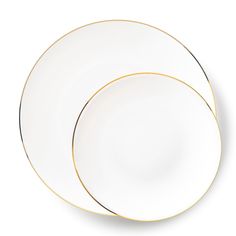 two white plates with gold trim on each plate, one is empty and the other has a black rim