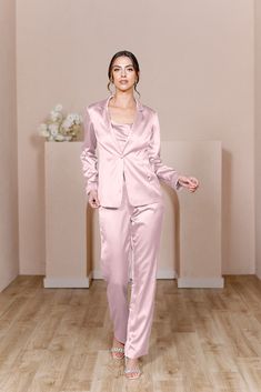 For the bridesmaid that doesn't want a dress, we have you covered! The new Ruby Satin Jacket & Pants set provides a glamorous alternative to a dress and will still have you feeling chic, confident, and comfortable all night long! The Ruby Jacket and Ruby Pants are sold separately. Lindsey size 4, pictured with the Flynn Satin Top in Desert Rose, sold separately. Laken size 24, pictured with the Heidi Chiffon Top in White Pearl, sold separately. FEATURES: Fitted Pants silhouette Side zipper Full- Pink Suits Women, Pants Silhouette, Jacket Silhouette, Bridesmaid Satin, Wedding Parties Colors, Fitted Pants, Satin Jacket, Blush Bride, Fitted Jacket