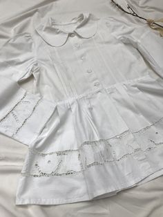 Amazingly detailed vintage 40's/50's blaser or blouse with extreme puff sleeves, peplum and cotton buttons, petern pan collar and cut out lace richelieau with roses. Goes well with an understated crop top and high waisted jeans. Very Rouje-esque, but Eastern European + original. Sits a size small to large. Measurements soon. Excellent condition, rare piece. Puff Sleeve Tops With Lace Cuffs For Daywear, Victorian Long Sleeve Tops For Spring, Fitted Cotton Top With Lace Patchwork, Fitted Bishop Sleeve Tops With Buttons, Puff Sleeve Blouse With Lace Cuffs For Daywear, Victorian Cotton Fitted Blouse, Fitted Victorian Cotton Blouse, Fitted Cotton Top With Bishop Sleeves, Fitted Cotton Tops With Bishop Sleeves