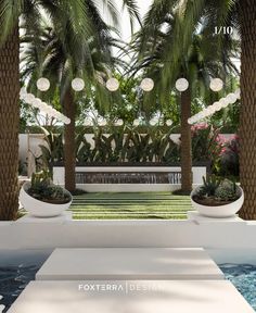 an outdoor pool area with palm trees and lights hanging from it's ceiling over the water