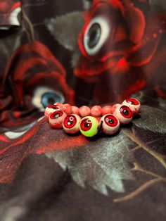 Handmade Creepycute Eyeball Bracelet Main Materials: Clay & Resin Eyeball Bead: around 0.7 - 1cm Handmade in Hong Kong.  Hope you will love them! All accessories will be cleaned and pack it carefully. If you like a custom order, please contact me. 💌 Welcome to Pencilman's creepy world! 🌹👻 Please follow my instagram: @made_by_pencilman Novelty Pink Friendship Bracelets With Round Beads, Fun Adjustable Beads For Gifts, Casual Bracelets With Wooden Beads As Gift, Cute Red Friendship Bracelets With Round Beads, Red Friendship Bracelets With Round Beads, Playful Beaded Bracelets As Gift, Handmade Red Beaded Bracelets, Cute Adjustable Round Beaded Bracelets, Fun Red Bracelet Gift