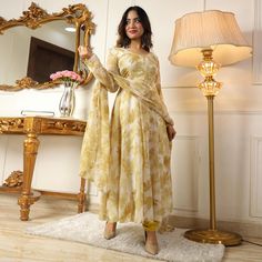 Light Yellow colored anarkali suit is prettified with floral printed work as shown which makes it appear classy. This top is made of georgette fabric which is accompanied with crepe bottom, inner and printed georgette dupatta. Women can buy this suit to wear for their parties and functions. Note:- The actual product may differ slightly in color and design from the one illustrated in the images when compared with computer or mobile screen. Size Chart Size: Semi Stitched/Unstitched can be altered Georgette Anarkali Suits, Georgette Anarkali, Georgette Dupatta, Mobile Screen, Anarkali Suit, Georgette Fabric, Screen Size, Surprise Gifts, Yellow Floral