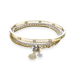 The Golden Gear Bracelet Stack, a three-piece gold bracelet stack featuring a bangle with diamond-like accents, a diamond-like tennis bracelet, and a chain bracelet with two charms. Golden Bracelet Stack, Where To Get Cute Jewelry, Pandora Bracelet Stack, Stockholm Jewelry, Every Jewels, Mixed Metals Jewelry, Bracelet Stack Gold, Silver And Gold Bracelet, Gold Bracelet Stack