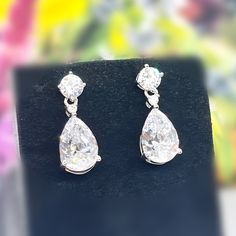 "Length : 0.8\" (2 cm) Main Stone Size: 1.2 cm X 0.8 cm (3 Carat / each) Main Stone Color: Clear White Main Stone Shape: Pear Cut Metal: Real Solid 925 Sterling Silver Hallmark: 925 Plating: Rhodium Plated Stones Setting: Prong Stones: High Quality Lab Moissanite Diamond Finish: High Polished Pear Dangle Drop Earrings 3 Carat Pear Cut Lab Moissanite Diamond 925 Sterling Silver Dangle Drop Wedding Earrings Gift Boxed For Her" Diamond White Pear-shaped Teardrop Earrings For Formal Occasions, Silver Pear-shaped Diamond Earrings For Formal Events, Silver Jewelry With Brilliant Cut Pear Shape, Formal Sterling Silver Bridal Earrings With Pear Shape, Elegant Sterling Silver Teardrop Earrings With Brilliant Cut, Silver Pear-shaped Jewelry With Brilliant Cut, Pear-shaped Sterling Silver Bridal Earrings For Formal Events, Pear-shaped Sterling Silver Bridal Earrings For Formal Occasions, Pear-shaped Silver Earrings With Diamond Cut