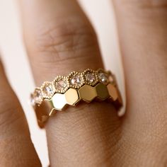 The Plain Hexagon Eternity Ring is a subtle way to add a pop of texture to your ring stack. Fine Jewelry Octagon Stackable Rings, Yellow Gold Octagon Faceted Rings, Gold Faceted Stackable Wedding Rings, Yellow Gold Hexagon Rose Cut Diamond Jewelry, Faceted Diamond Ring In Gold, Gold Diamond Ring With Faceted Cut, Hexagon Ring With Single Cut Diamonds For Anniversary, Gold Hexagon Rose Cut Diamond Jewelry, Hexagon Rose Cut Diamond Gold Jewelry