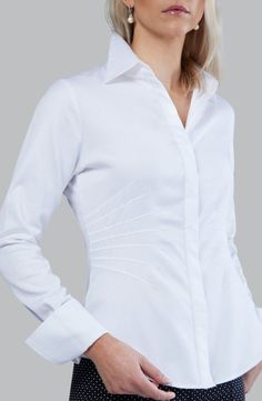 [shortdesc]Farinaz Signature Classic shirts are simply a cut above. This is her passion. Try one on and you'll see and feel the difference. This beautiful shirt offers pleated detail on the waist creating a slimmer look. Made to fit your body, this shirt is both comfortable and chic with a unique feature that makes it one of a kind. Looks great with one of our blazers or vests. Comes in a variety of colors and fabrics. All Farinaz Signature Classic shirts are tailored to meet the shape and form Formal Shirt Design, White Shirt Blouse, White Button Down Shirt, Fitted Shirt, Woman Silhouette, Hot Outfits, Simple Elegance, Formal Shirts, Classic Shirt