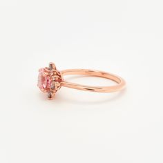 14K recycled gold Set in the center with a lovely 1.15ct (6mm) round cut lab grown rosé sapphire. With a blush hue reminiscent of the lovely color of morganite, our rosé sapphire features a slightly more saturated peachy-pink color, and offers a much better durability than morganite, making it ideal for an engagement ring! One of a kind asymmetrical cluster halo featuring sparkly colorless lab grown diamonds, peppered with moody grey moissanite, for a to-die-for salt and pepper halo! Truly a uni Spinel Engagement Rings, Grey Moissanite, Montana Sapphire Engagement, Montana Sapphire Engagement Ring, Engagement Ring Pictures, Montana Sapphire Ring, Natural Gemstone Ring, Sapphire Engagement Ring Blue, Engagement Rings Platinum