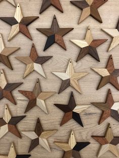 several wooden stars are arranged on a table