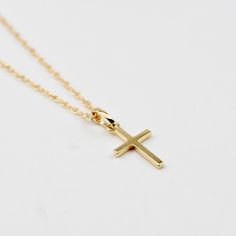 Solid Gold Cross Necklace. 14k cross pendant and necklace. This necklace is both elegant and beautiful. This is a beautiful necklace that is both timeless and precious. A great gift for graduation, communion or baptism. The necklace will arrive in a gift box, ready for delivery. The cross pendant is solid 14K gold, it is about 17mm x 10mm. 14K gold necklace All components are 14k gold Please read our policies before you place your order. https://www.etsy.com/shop/SashJewelry/policy?ref=shopinfo_ 14k Gold Cross Necklace For First Communion, Minimalist Cross Pendant Necklaces For Baptism, Minimalist Cross Pendant Necklace For Baptism, Classic Cross Pendant Necklace As Gift, Yellow Gold Cross Pendant Necklace For First Communion, 14k Gold Cross Pendant Necklace For First Communion, Yellow Gold Cross Necklace For First Communion, Minimalist Cross Pendant Necklace For First Communion, Classic Cross Pendant Jewelry For First Communion