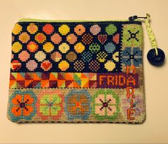 a small purse is decorated with multicolored beads