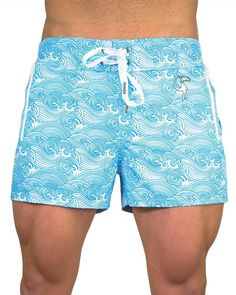 This modern and sleek design will make you the envy of other beachgoers – Make Waves Blue. Providing ultimate aesthetics and comfort, these swim trunks feature 4-way stretch, flexible fabric and a semi-elastic waistband. To elevate the premium feel of our blue swim trunks, we’ve placed luxe silver hardware to the drawstrings and a raised rubber Tucann logo. Look good and feel comfortable 24/7 with in-built underwear and quick drying capabilities. Think they look great? Wait till you try them on! Blue Swimwear With Built-in Shorts For Surfing, Blue Bottoms For Water Sports During Beach Season, Blue Swimwear With Built-in Shorts For Vacation, Blue Short-length Swimwear For Poolside, Blue Swim Trunks With Built-in Shorts For Water Sports, Beachwear Blue Short Swim Trunks, Blue Swim Trunks For Summer, Light Blue Swim Trunks For Summer Beachwear, Light Blue Swim Trunks For Summer