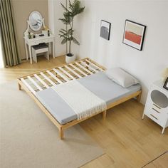 a bedroom with a bed frame and mattress