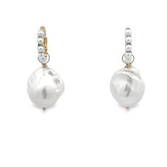 When you want a fun, but ladylike take on a pure classic, these unique white freshwater pearl 'huggie" hoop earrings are the way to go. These are an easy every day piece that you're sure to love as much with workout clothes as you do with a sleek black top and jeans. If you want to take it up a notch, simply add some of our charm drops for a pop of color or an additional pearl. However you wear them, you're sure to get compliments and these beauties are classic enough to be handed down for gener White Pearl Huggie Earrings With Pearl Charm, Elegant White Huggie Earrings For Everyday, Elegant Round Baroque Pearl Hoop Earrings, Pearl Pendant Huggie Earrings, White Small Hoop Huggie Earrings With Pearl Drop, Classic Pearl Huggie Earrings, White Round Huggie Earrings With Pearl Drop, White Huggie Earrings With Pearl Drop, Yellow Gold Pearl Huggie Earrings